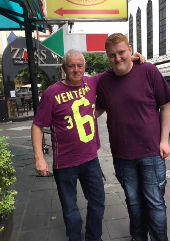 Justin Chappell standing beside his dad