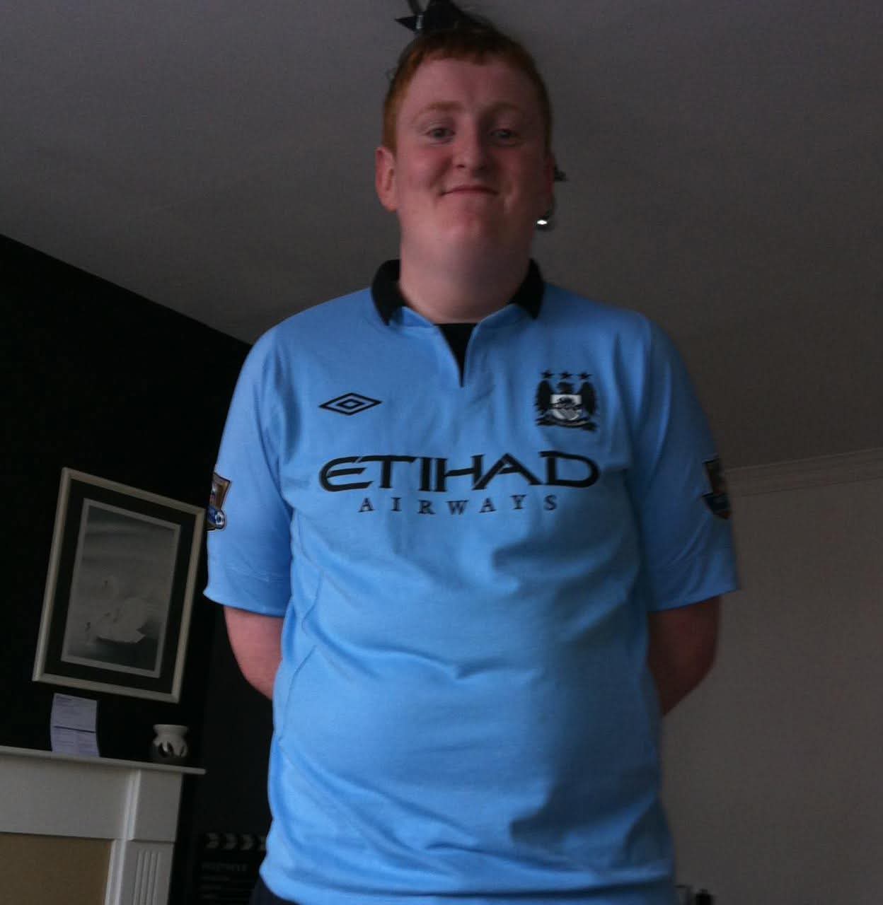 Justin wearing a Manchester City shirt