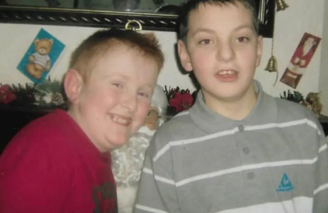 Younger photograph of Justin with another child