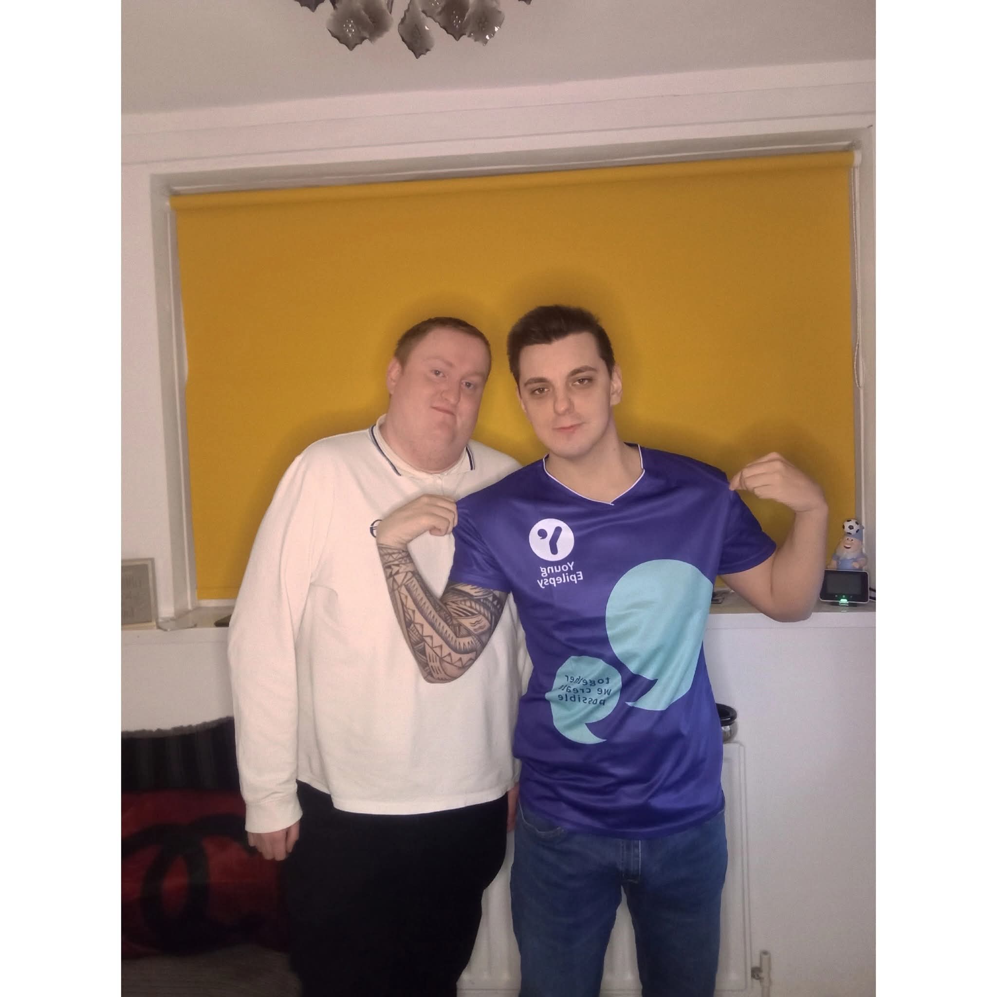 Justin pictured with another person, one of them in a football shirt