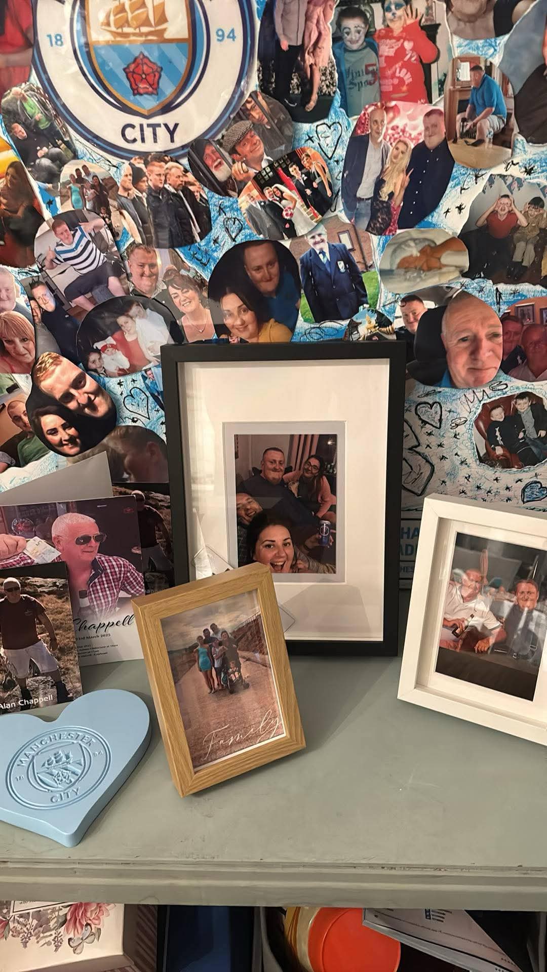 Memorial display featuring many photographs and Manchester City items